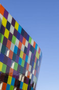 The Glass Mill Leisure Centre is situated on the lowest three floors of a 27 storey apartment building in Lewisham. The leisure centre includes 1400 glass panels in ten colours illuminated from behind. The lighting responds to the sounds outside of the centre. The new facility was designed by LA Architects and is managed by Fusion Lifestyle on behalf of Lewisham Council. The contractor for the project was Pellikaan, with additional work coming from Barratt Homes. The new centre features a 100-station fitness suite, a 25m, 8-lane swimming pool, a teaching pool, two group exercise studios, a rock climbing wall, a crèche, café and health suite, which includes a sauna, steam room, ice room and a relaxation area.
