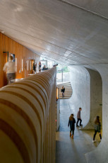 GHG Education Building, Hallway, Sound-Absorbing Porous Concrete Wall Detail