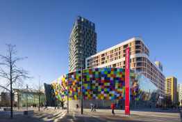 The Glass Mill Leisure Centre is situated on the lowest three floors of a 27 storey apartment building in Lewisham. The leisure centre includes 1400 glass panels in ten colours illuminated from behind. The lighting responds to the sounds outside of the centre. The new facility was designed by LA Architects and is managed by Fusion Lifestyle on behalf of Lewisham Council. The contractor for the project was Pellikaan, with additional work coming from Barratt Homes. The new centre features a 100-station fitness suite, a 25m, 8-lane swimming pool, a teaching pool, two group exercise studios, a rock climbing wall, a crèche, café and health suite, which includes a sauna, steam room, ice room and a relaxation area.