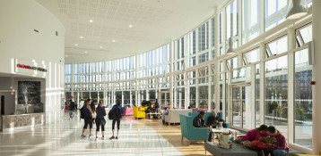 The Glass Mill Leisure Centre is situated on the lowest three floors of a 27 storey apartment building in Lewisham. The leisure centre includes 1400 glass panels in ten colours illuminated from behind. The lighting responds to the sounds outside of the centre. The new facility was designed by LA Architects and is managed by Fusion Lifestyle on behalf of Lewisham Council. The contractor for the project was Pellikaan, with additional work coming from Barratt Homes. The new centre features a 100-station fitness suite, a 25m, 8-lane swimming pool, a teaching pool, two group exercise studios, a rock climbing wall, a crèche, café and health suite, which includes a sauna, steam room, ice room and a relaxation area.