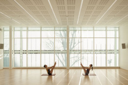 The Glass Mill Leisure Centre is situated on the lowest three floors of a 27 storey apartment building in Lewisham. The leisure centre includes 1400 glass panels in ten colours illuminated from behind. The lighting responds to the sounds outside of the centre. The new facility was designed by LA Architects and is managed by Fusion Lifestyle on behalf of Lewisham Council. The contractor for the project was Pellikaan, with additional work coming from Barratt Homes. The new centre features a 100-station fitness suite, a 25m, 8-lane swimming pool, a teaching pool, two group exercise studios, a rock climbing wall, a crèche, café and health suite, which includes a sauna, steam room, ice room and a relaxation area.