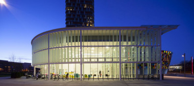 The Glass Mill Leisure Centre is situated on the lowest three floors of a 27 storey apartment building in Lewisham. The leisure centre includes 1400 glass panels in ten colours illuminated from behind. The lighting responds to the sounds outside of the centre. The new facility was designed by LA Architects and is managed by Fusion Lifestyle on behalf of Lewisham Council. The contractor for the project was Pellikaan, with additional work coming from Barratt Homes. The new centre features a 100-station fitness suite, a 25m, 8-lane swimming pool, a teaching pool, two group exercise studios, a rock climbing wall, a crèche, café and health suite, which includes a sauna, steam room, ice room and a relaxation area.