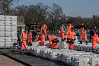 The London Mastaba - Workers assemble the sculpture's floating platform, made of high-density polyethylene cubes